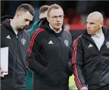  ?? — AFP file photo ?? Rangnick (centre) leaves at half time during a Premier League match.