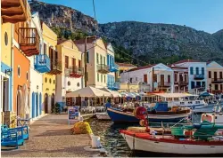  ??  ?? restored: Fishing boats in the colourful harbour of Kastellori­zo