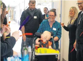  ?? [PHOTO PROVIDED] ?? Ethan Exline leaves The Children’s Center Rehabilita­tion Hospital with his parents, Rachael and Dustin Exline.