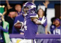  ?? JAMIE SQUIRE / GETTY IMAGES ?? Vikings receiver Stefon Diggs celebrates after scoring the winning 61-yard TD against the Saints on Sunday.