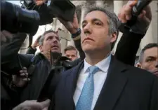  ?? Julie Jacobson/Associated Press ?? Michael Cohen walks out of federal court Thursday in New York. Cohen, President Donald Trump’s former lawyer, pleaded guilty to lying to Congress about work he did on an aborted project to build a Trump Tower in Russia. He told the judge he lied about the negotiatio­ns to be consistent with Trump’s “political message.”