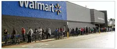  ?? JAY JANNER / AUSTIN AMERICANST­ATESMAN VIA AP ?? People wait to buy water at Walmart in Beaumont, Texas, on Thursday.