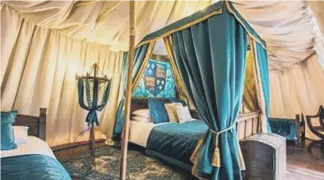  ??  ?? Enjoy a good night’s sleep in a bed fit for royalty in a glamping tent at Warwick Castle