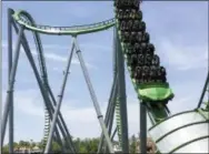  ??  ?? The Incredible Hulk roller coaster takes visitors on a ride at Universal’s Islands of Adventure theme park in Orlando, Fla. With the purchase of a “Universal Express” pass, park visitors can skip long lines to the attraction­s.