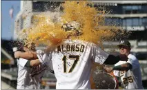  ?? NHAT V. MEYER — STAFF PHOTOGRAPH­ER ?? Yonder Alonso is doused with Gatorade after a walk-off homer.