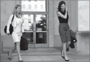  ?? The Associated Press ?? CAPITOL HILL: Former FBI lawyer Lisa Page, right, leaves the Rayburn House Office Building after a closed doors interview with the House Judiciary and House Oversight and Government Reform committees Friday on Capitol Hill in Washington.