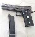  ??  ?? The air pistol and magazine recovered at the suspect’s rented apartment unit.