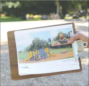  ?? BEA AHBECK/NEWS-SENTINEL ?? Lions Club and Foundation treasurer Richard Prima shows a rendering of the planned small children’s playground at Emerson Park in Lodi on Thursday.