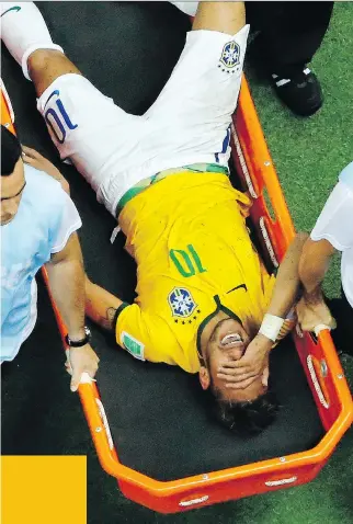  ?? FABRIZIO BENSCH/ THE ASSOCIATED PRESS ?? Brazil’s Neymar suffered a broken vertebra against Colombia on Friday. He will be out for the rest of the tournament.