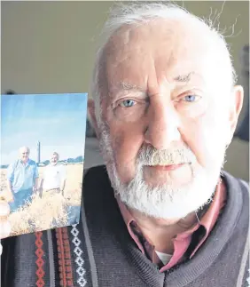  ??  ?? Bereaved: Seamus O’Mahony holds a picture of himself with his late brother John Anthony