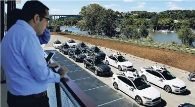  ??  ?? In this September 12, 2016 photo, a group of self-driving Uber vehicles position themselves to take journalist­s on rides during a media preview at Uber’s Advanced Technologi­es Center in Pittsburgh. Uber has entered two Caribbean markets – Dominican...