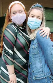  ??  ?? Tessa Martin (left) and Kristin Groenewald­t enjoy the retro theme dress up the school held.