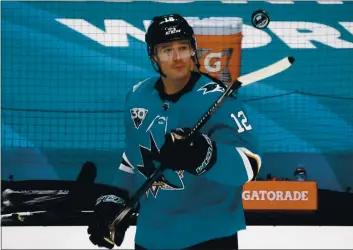  ?? NHAT V. MEYER — BAY AREA NEWS GROUP ?? San Jose Sharks’ Patrick Marleau (12) juggles a puck with his stick during warm-ups before their game against the Los Angeles Kings at the SAP Center in San Jose on March 22.