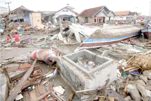  ?? — AFP photo ?? This general view shows destroyed or damaged homes in Sumur on Java island, two days after the tsunami.