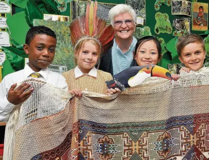  ??  ?? Missionary Irene Rowley with pupils Ilyas Boateng, Ruby Hyde, Kayley Lam and Charlie Bryning