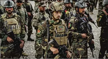  ?? Marcus Yam Los Angeles Times ?? SPECIAL operations commandos stand in formation for a visit by the Afghan army’s chief of staff in Kabul in April. The elite forces appear to be the only units capable of standing as a bulwark against the Taliban.