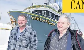  ?? AARON BESWICK PHOTO ?? Theodore Genge and his father Rufus in front of the KMKA Voyager in Anchor Point, N.L. The shrimp dragger’s engine is powerful enough to haul two trawls the 400 nautical miles from the shrimp grounds, but those stocks are beginning to collapse.