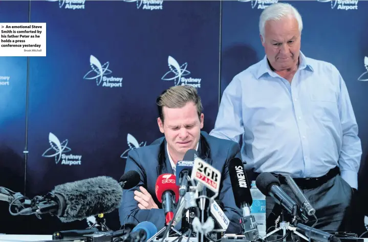  ?? Brook Mitchell ?? > An emotional Steve Smith is comforted by his father Peter as he holds a press conference yesterday