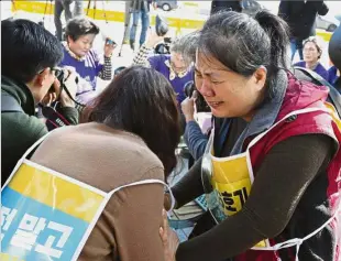  ??  ?? opposing the constructi­on of nuclear reactors crying after a state commission announced the public survey result for stalled nuclear reactors in front of the government complex in Seoul. — AP Tears against nukes: People