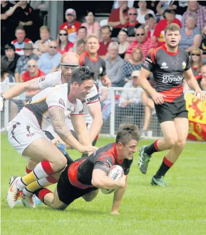  ?? Les Evans ?? Toby Adamson in action for North Wales Crusaders