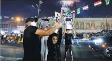  ?? WISSAM AL-OKAILI / REUTERS ?? People celebrate on a street in Baghdad on Monday after preliminar­y results of Iraq’s parliament­ary elections were announced.