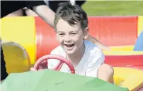  ??  ?? A fun occasion . . . Sam Cockburn (5), of Dunedin, enjoys a ride in a bumper boat.