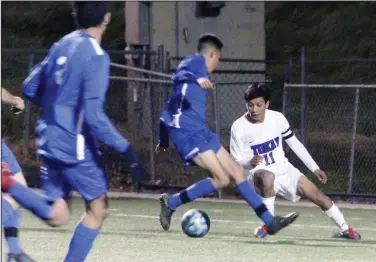  ?? MIKE BUSH/NEWS-SENTINEL ?? Tokay striker Ivan Rosales (11) gets ready to take away the ball in Tuesday's Sac-Joaquin Section Division I boys soccer playoff game at the Grape Bowl.