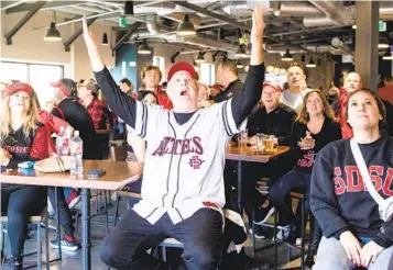  ?? MEG MCLAUGHLIN U-T ?? San Diego State alum Andrew Stang (center) reacts after a foul was called against the Aztecs during Sunday’s watch party at Alesmith Brewery for the Elite Eight matchup against Creighton.