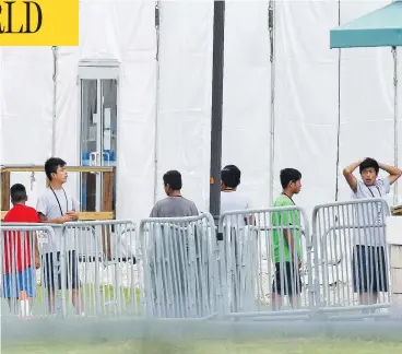  ?? BRYNN ANDERSON/THE ASSOCIATED PRESS ?? Children separated from their parents are pictured at a Miami-area detention centre for illegal immigrants on Wednesday. “Obviously this is not the way we do things in Canada,” said Prime Minister Justin Trudeau.