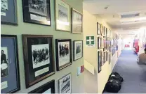  ?? PHOTOS: JAMIE MORTON ?? The main corridor at Scott Base boasts the group picture of every team who has spent winter on the ice since the late 1950s. Below: Everyone on Scott Base is required to attend regular Saturday meetings.