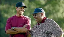  ?? PHOTO: GETTY IMAGES ?? Earl Woods, pictured with Tiger in 2004, comes in for the harshest characteri­sation in the biography.