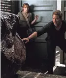  ?? GILES KEYTE ?? Don’t wake the dinosaur: Owen (Chris Pratt) and Claire (Bryce Dallas Howard) return in “Fallen Kingdom.”