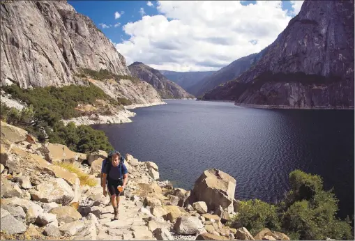  ?? COURTESY OF DINO VOURNAS ?? The Wapama Falls trail next to Yosemite’s Hetch Hetchy Reservoir takes wilderness lovers on a 2 1⁄2-mile trek to the waterfall, which is still flowing this fall, thanks to abundant winter rains.