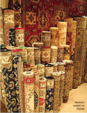  ??  ?? Kashmiri carpets on display