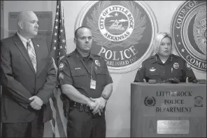  ?? Arkansas Democrat-Gazette/ MITCHELL PE MASILUN ?? Assistant Chief Alice Fulk (right) speaks to the media Monday at Little Rock’s main police station downtown to announce that Little Rock police have acquired 160 Narcan kits for officers to use in opioid overdoses. Next to Fulk are state Drug Director...