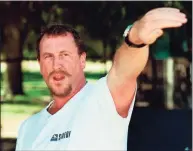  ?? E.J. Flynn / Associated Press ?? In this April 26, 1997, photo, George Holliday points to the spot along a roadside in the Lake View Terrace section of Los Angeles where he videotaped Rodney King being beaten in April 1992.