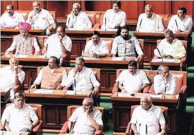  ?? PHOTO: PTI ?? BJP leader B S Yeddyurapp­a ( front row) with party members at Vidhana Soudha in Bengaluru on Saturday