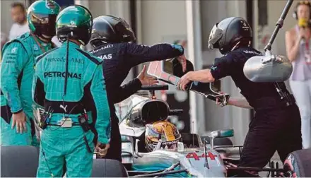  ?? EPA PIC ?? Mechanics change the headrest on the Mercedes car of Lewis Hamilton during a pit stop on Sunday.