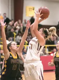  ?? Staff photo by Kayleigh Moreland ?? Varsity Fouke player Lakyn Smallwood guards New Boston’s Carlee Ratcliff while she shoots a goal on Thursday at the Lion Gym in a varsity game during the opening round of the Gunslinger Tournament. Fouke won, 63-43. The Lady Panther-Lady Lion result...