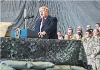  ?? OLIVIER DOULIERY AFP VIA GETTY IMAGES ?? U.S. President Donald Trump told military personnel at Bagram air field Thursday that victory in Afghanista­n would be achieved through “a political solution” determined by those in the region.