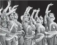  ?? Steve Gonzales / Staff photograph­er ?? Traditiona­l dancers entertain the crowd before Modi’s apperance at NRG Stadium.