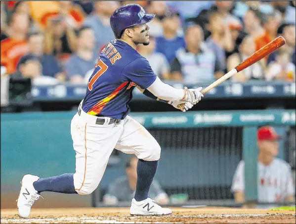  ?? BOB LEVEY / GETTY IMAGES ?? Not only has Astros second baseman Jose Altuve played in every game this season, he’s leading the majors in batting average and the American League in hits. He’s second in the AL in steals. His season rivals Ty Cobb’s historic performanc­e in 1917.