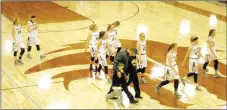  ?? MARK HUMPHREY ENTERPRISE-LEADER ?? What’s wrong with this picture? Prairie Grove coach Kevin Froud walks off the court accompanie­d by his sons at the same time the Lincoln girls basketball team leaves Wolfpack Arena.