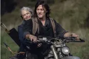  ?? PHOTOS BY ELI ADE — AMC ?? Norman Reedus and Melissa McBride star in “The Walking Dead.” The last six episodes of season 10, which were announced over the summer, kick off Sunday at 6p.m. on AMC.