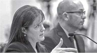  ??  ?? Tennessee Commission­er of Education Dr. Candice McQueen sits next to Chief Operating Officer for Questar, Brad Baumgartne­r, as she testifies April 18 before the House Government Operations committee at the Cordell Hull Building in Nashville, Tenn. LACY ATKINS / USA TODAY NETWORK-TENNESSEE