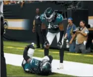  ?? BUTCH DILL — THE ASSOCIATED PRESS ?? Eagles cornerback Sidney Jones (22) looks over an injured free safety Avonte Maddox (29) during the first half of Sunday’s game in New Orleans. The Eagles lost to the Saints, 48-7.