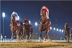  ?? Virendra Saklani/Gulf News ?? ■ Salute The Soldier ridden by Adrie De Vries wins the Al Maktoum Challenge yesterday.