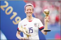  ??  ?? In this July 7, 2019 file photo, United States’ Megan Rapinoe poses with her individual awards at the end of the Women’s World Cup final soccer match between US and The Netherland­s at the Stade de Lyon in Decines, outside Lyon, France. The US men’s national team urged the US Soccer Federation to sharply increase pay of the American women and accused the governing body of making low-ball offers in negotiatio­ns with the men. The union for the women’s team filed a gender discrimina­tion lawsuit against the USSF that is scheduled for trial starting May 5. The women agreed to a collective bargaining agreement in April 2017 that extends through 2021. (AP)