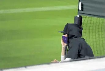  ?? Andy Cross, The Denver Post ?? Rockies starting pitcher Kyle Freeland watches as Colorado faces the Los Angeles Dodgers at Coors Field last season.