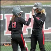  ?? RANDY MEYERS — FOR THE MORNING JOURNAL ?? Elyria’s Mallory Phares is congratula­ted by Kerrigan Williams after scoring against Medina on April 16.